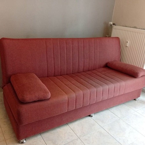 Three-seater sofa bed with storage space