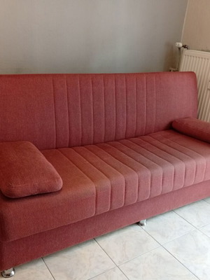 Three-seater sofa bed with storage space