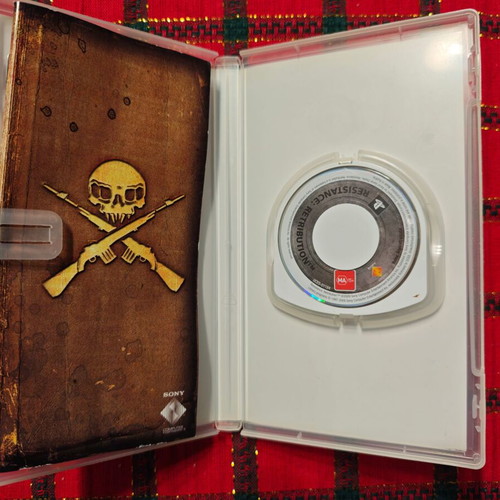 Resistance: Retribution PSP game used with booklet
