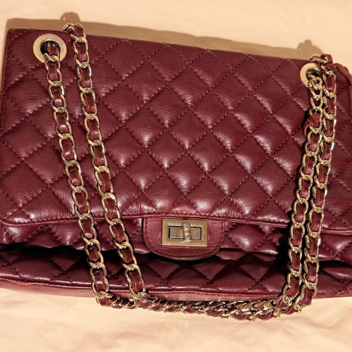 Italian leather shoulder bag used with wear on corners and chain