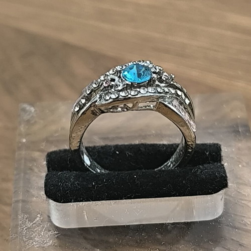 Silver vintage ring with blue zircon and white stones