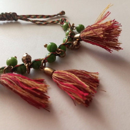 Bracelet new with green beads and red tassels boho style