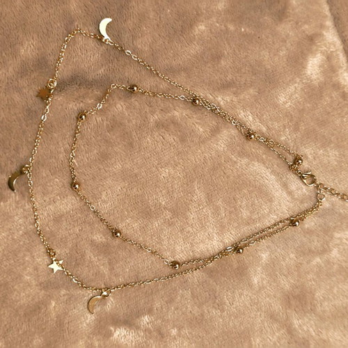 Double necklace in gold color like new with stars and crescent moons