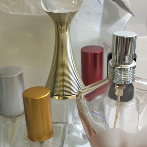 Empty perfume bottles used, including Jadore Dior and Jean Paul Gaultier