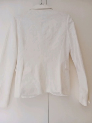 Jacket ecru with embossed patterns and two small back slits like new