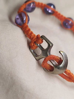 Macrame bracelet like new with purple glass beads