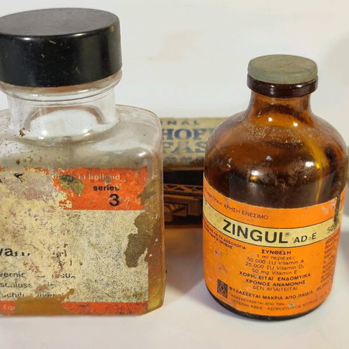 Antique staplers and two used bottles for decoration