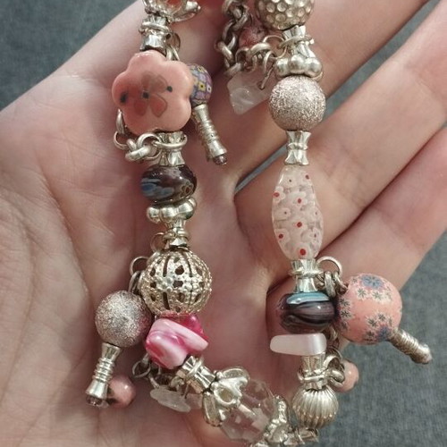 Women's bracelet with charms and pink beads like new