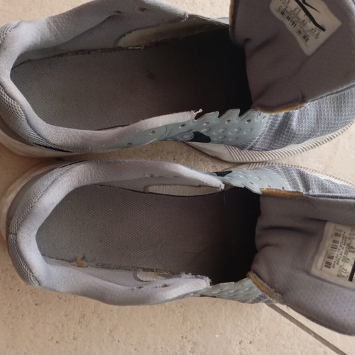 Nike men's athletic shoes, grey, size 43, missing laces