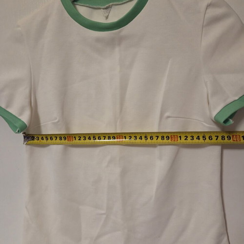 White blouse with green details, like new