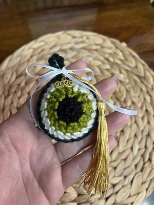 Handmade knitted Mati charm with gold 2026 element and tassel