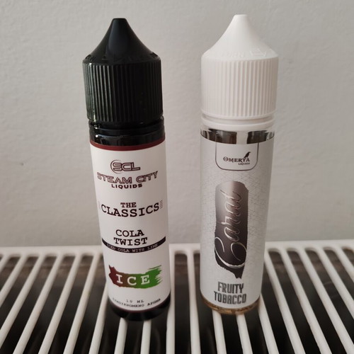 Steam City Flavour Shot Cola Twist and Omerta Carat fruity tobacco e-liquids like new