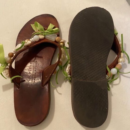 Leather slippers like new, decorated with beads and green ribbons, size 36
