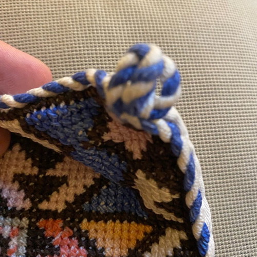 Embroidered pillow used with minor wear