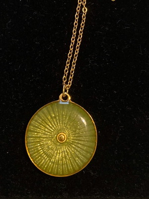 Necklace used, green-gold steel shield pendant