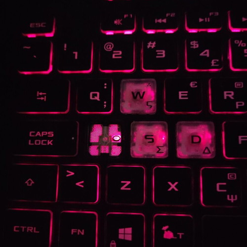ASUS ROG Strix G531GT gaming laptop with headphones and keyboard