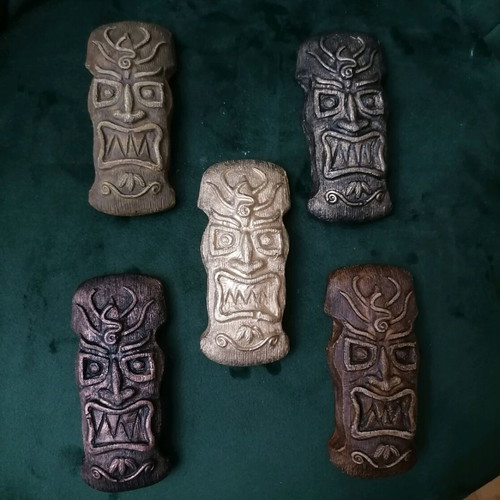 Handmade gypsum magnets and hanging totems painted with acrylics