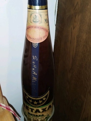 Metaxa bottle collectible new full with stand and tap