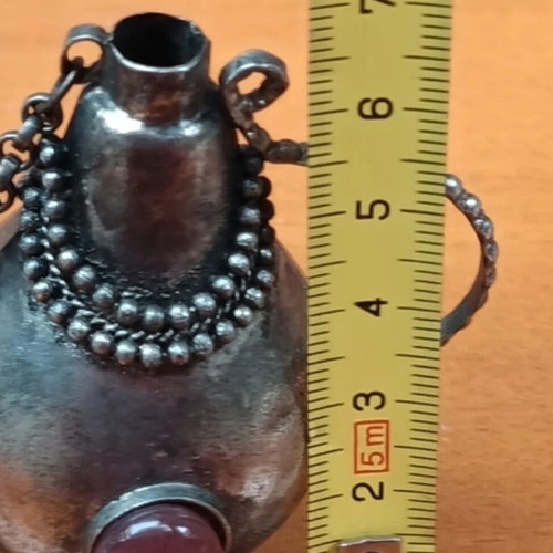 Perfume bottle antique like new, can be chained to necklace