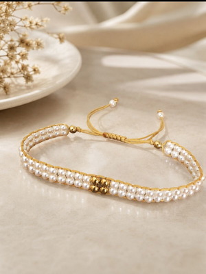 Woven bracelet with white pearls and gold hematite