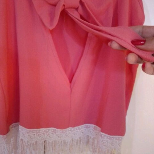 Blouse new with bow back and fringes bottom size L