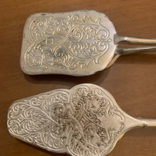 Silver-plated serving spoon and fork set used