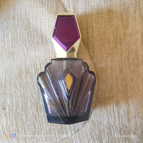 Elizabeth Taylor Passion perfume bottle used, without fragrance