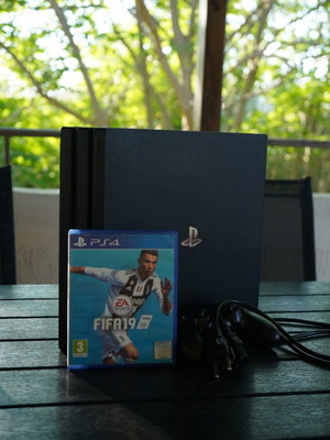 PS4 Pro 1TB console with FIFA 19 game, power cable and controller