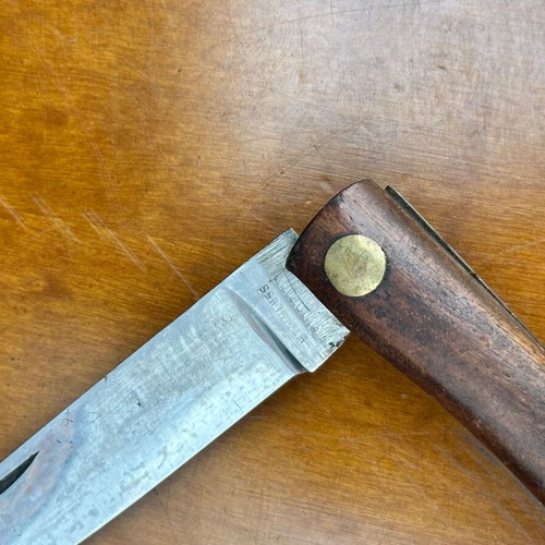 Vintage folding pocket knife with wooden handle, used, 10.7 cm