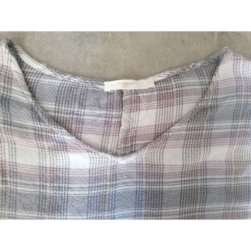 Cherry Paris poncho with checkered pattern and white tassels like new