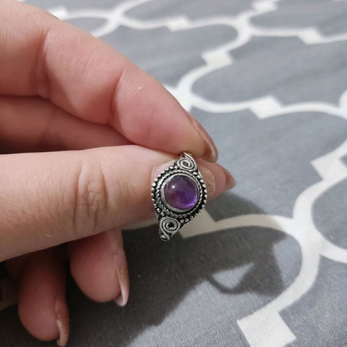 Ring with purple stone like new