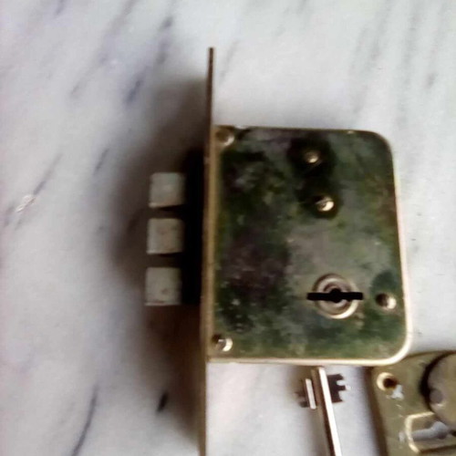 Triaina lock used with one key and metal keyhole cover