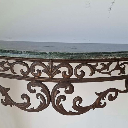 Metal console used with marble top and ornate wrought iron design