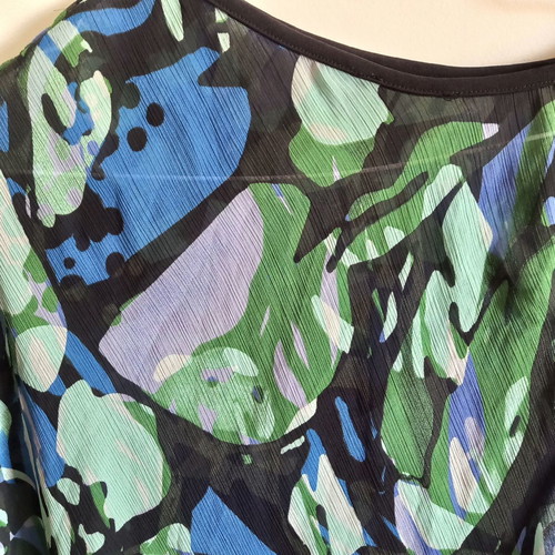 Asymmetric transparent blouse with blue-green print