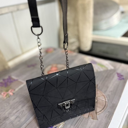 Women's black shoulder bag with geometric design, like new