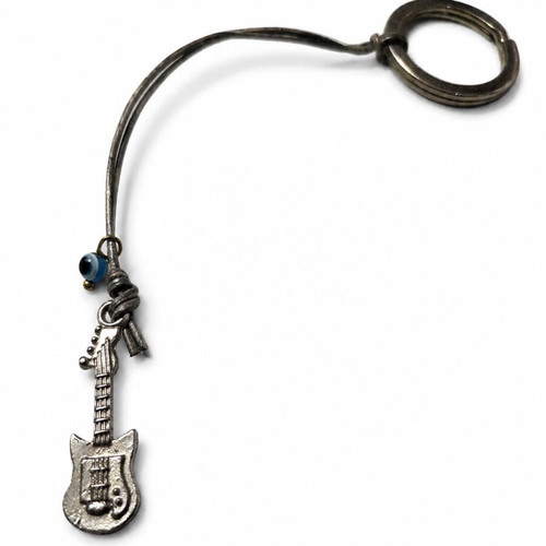Guitar Keychain like new with metal detail and vintage blue eye