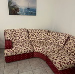 Circular fabric corner sofa used, red