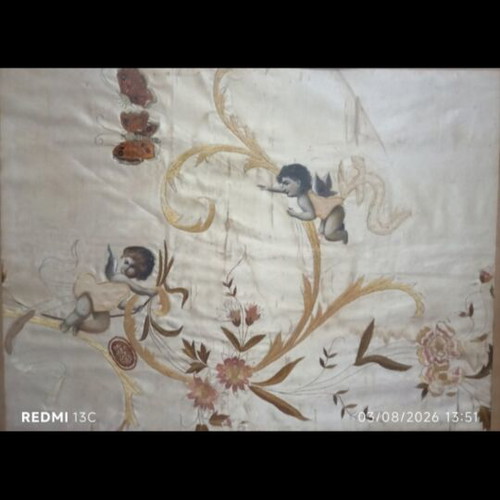 Embroidery with angels and flowers on silk or satin, used
