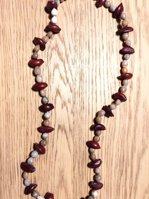 Ethnic necklace new made of exotic fruit seeds in gray-purple