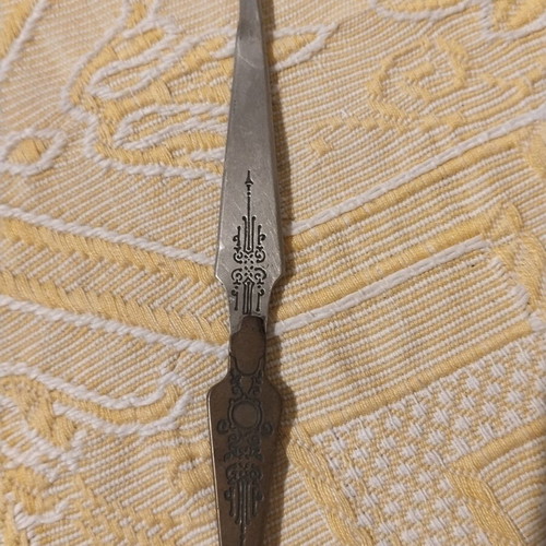 Vintage metal sewing stiletto with Art Nouveau motifs