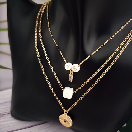Steel layered necklace gold plated with evil eye, crystal, ceramic stone and monogram new
