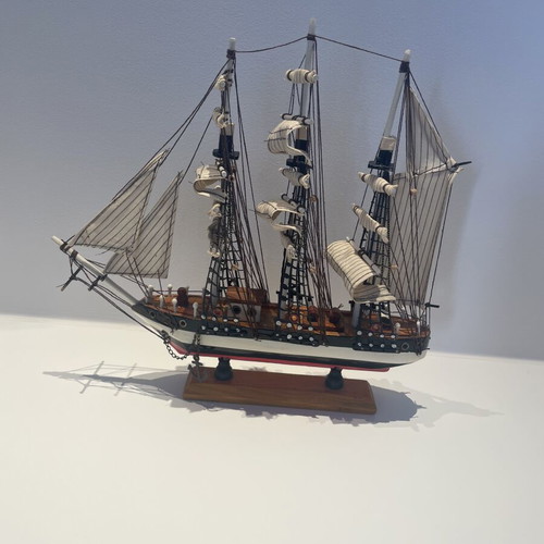 Vintage wooden decorative ship like new with striped sails and wooden base