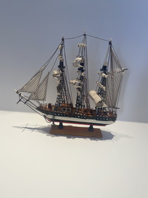 Vintage wooden decorative ship like new with striped sails and wooden base