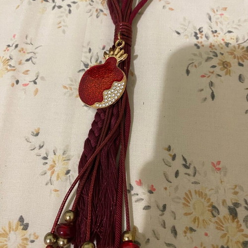 Red charm with pomegranate like new