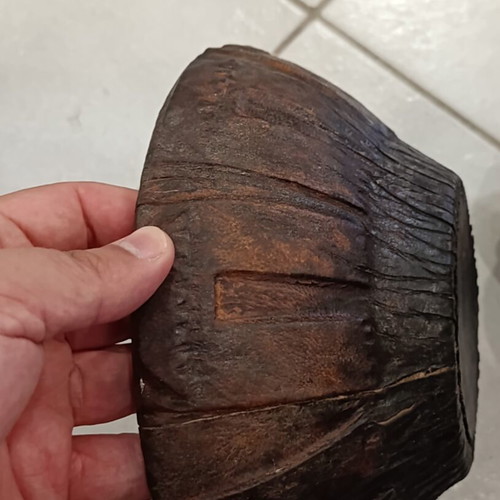 Antique wooden bowl with leather used