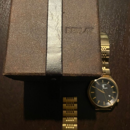 Replay wristwatch like new with black dial and gold bracelet