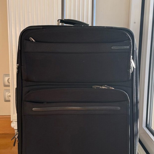 Delsey Black Medium Suitcase used with wheels