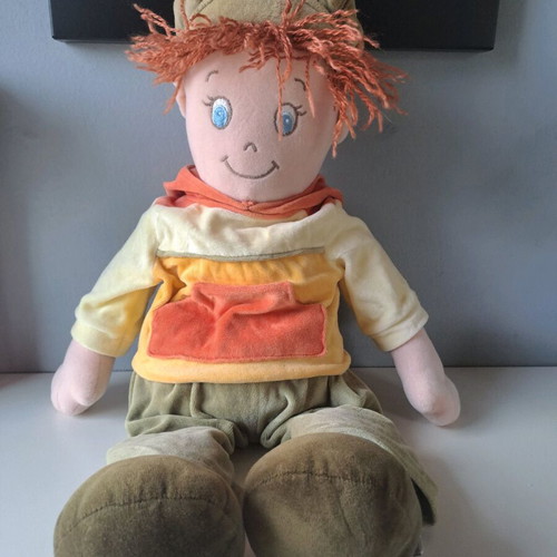 Cloth doll with hat and orange details like new