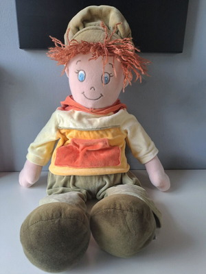 Cloth doll with hat and orange details like new
