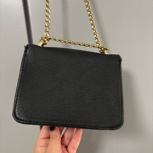 Shoulder bag with gold stars and chain like new, black